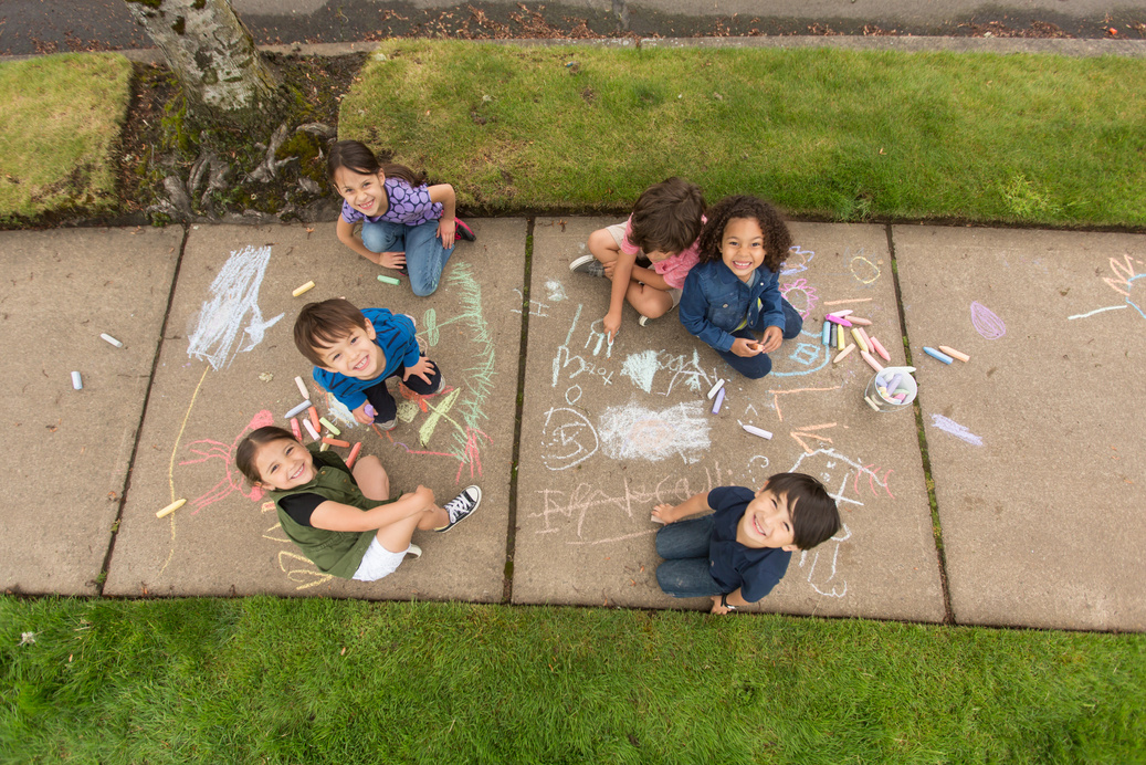 Neighborhood children playing together outside