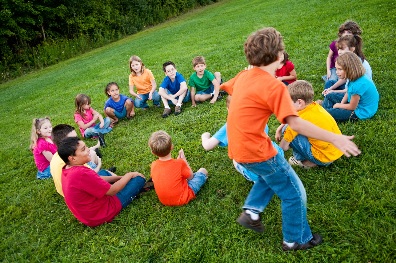 Happy Children Playing Duck, Goose Game Outside